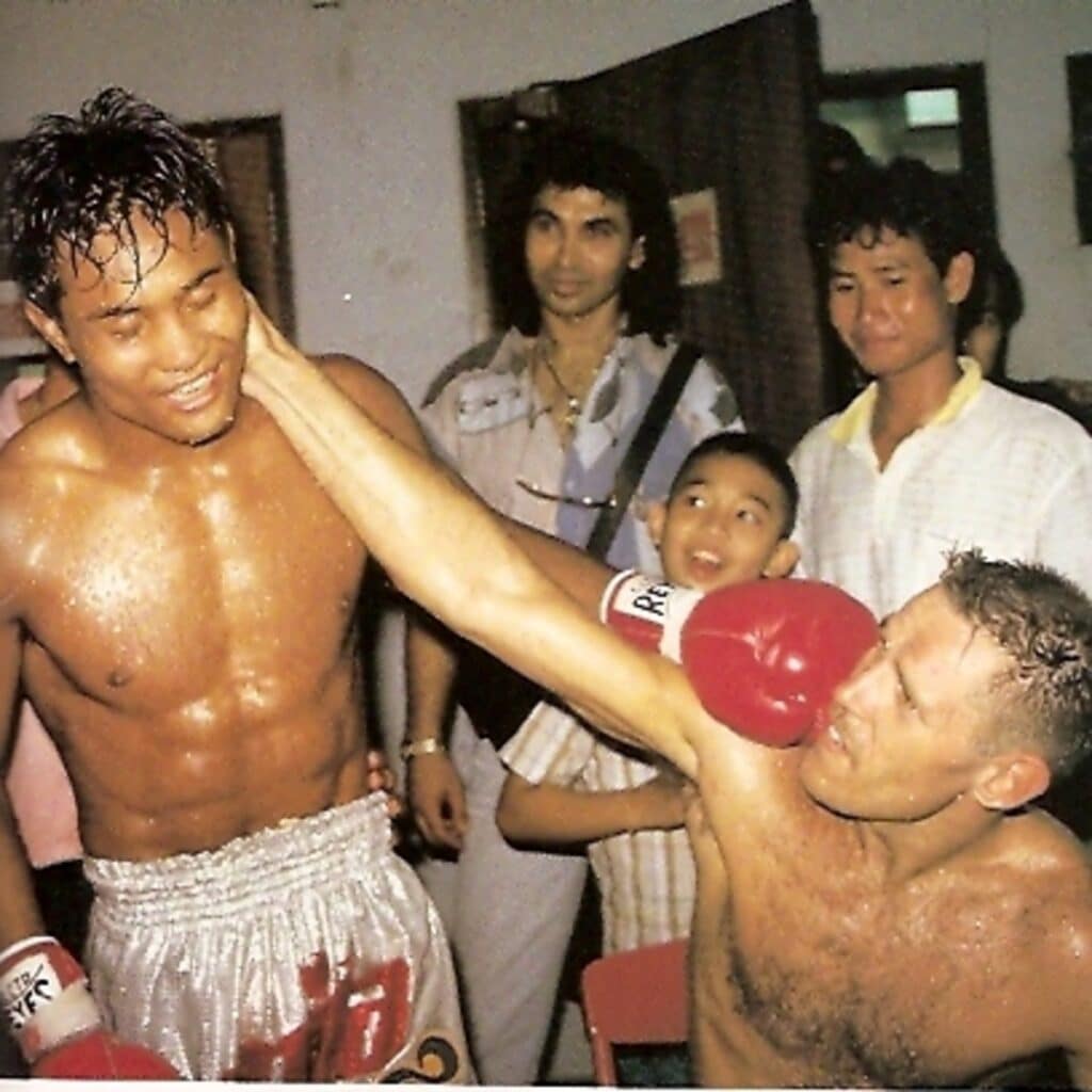 Rob Kaman and Changpuek Kiatsongrit backstage after their fight at Lumpinee Stadium in 1990