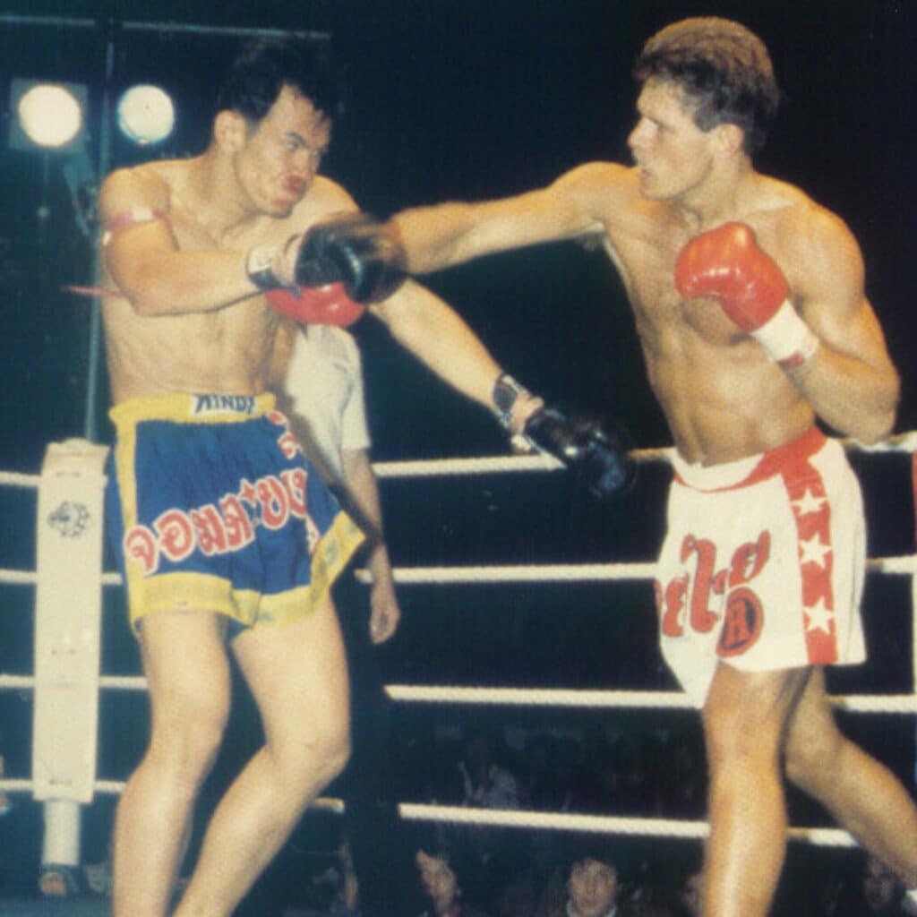 Rob Kaman delivering a right cross to Payap Premchai during their iconic bout.