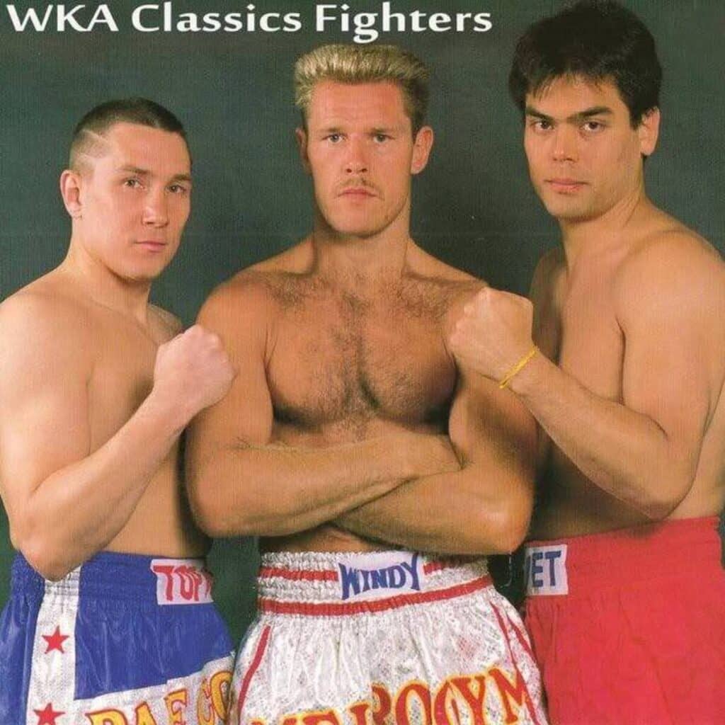 Photo of Dale Cook, Rob Kaman, and Don Nakaya Nielsen, legendary kickboxers from the WKA era, representing American, Dutch, and Japanese kickboxing styles, respectively.